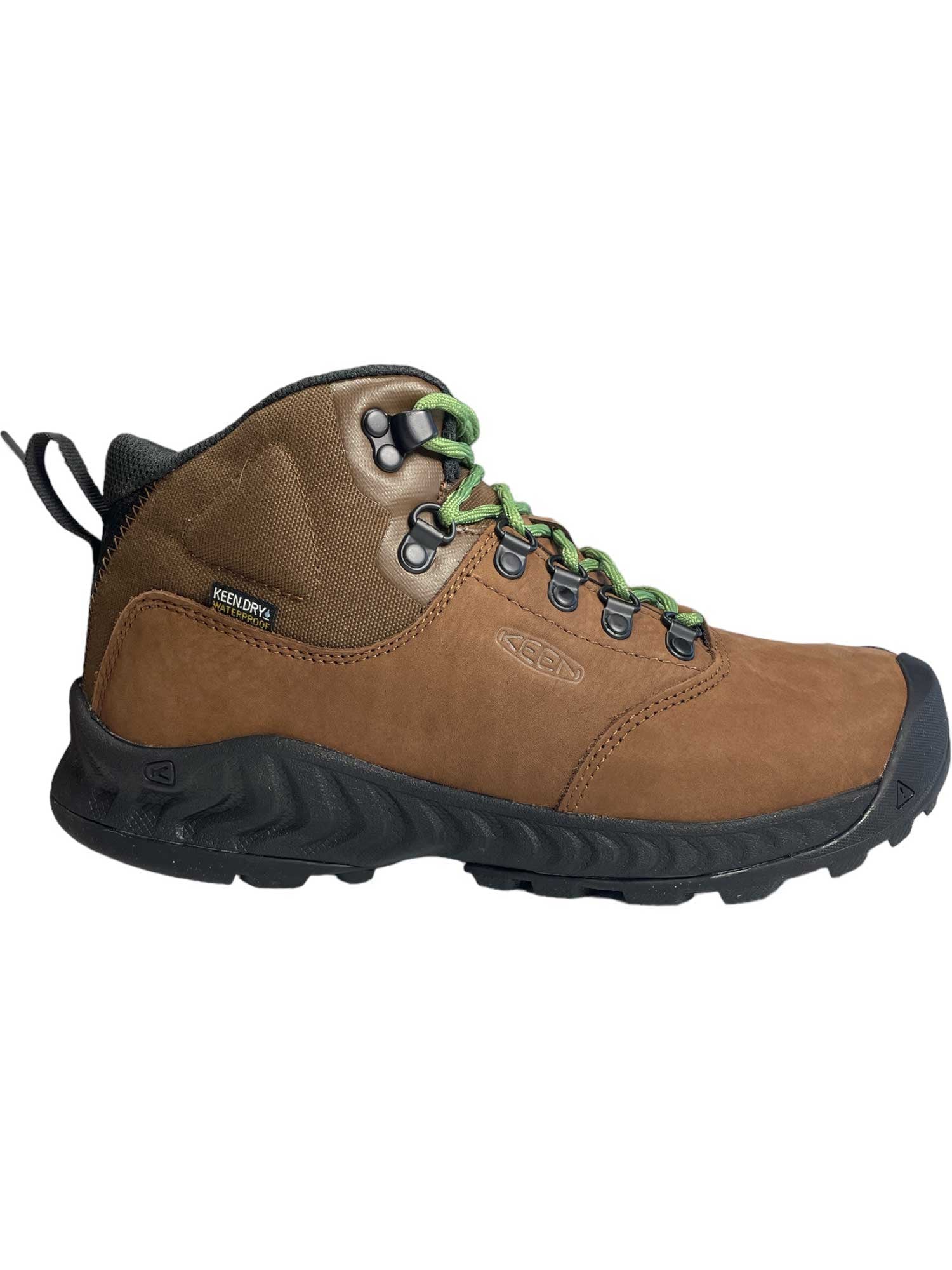 The KEEN Womens NXIS Explorer Mid Waterproof Shoe features premium brown nubuck leather, a black sole and toe cap, green and black laces with metal eyelets, black ankle padding, and a KEEN.DRY label—perfect for women's trail hikes.