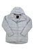 The light gray Womens WarmCube Havenmeyer Jacket features a quilted design, hood, front zipper, snap buttons, long sleeves, 800-fill-power down insulation, and a visible brand tag inside the collar for warmth and style.