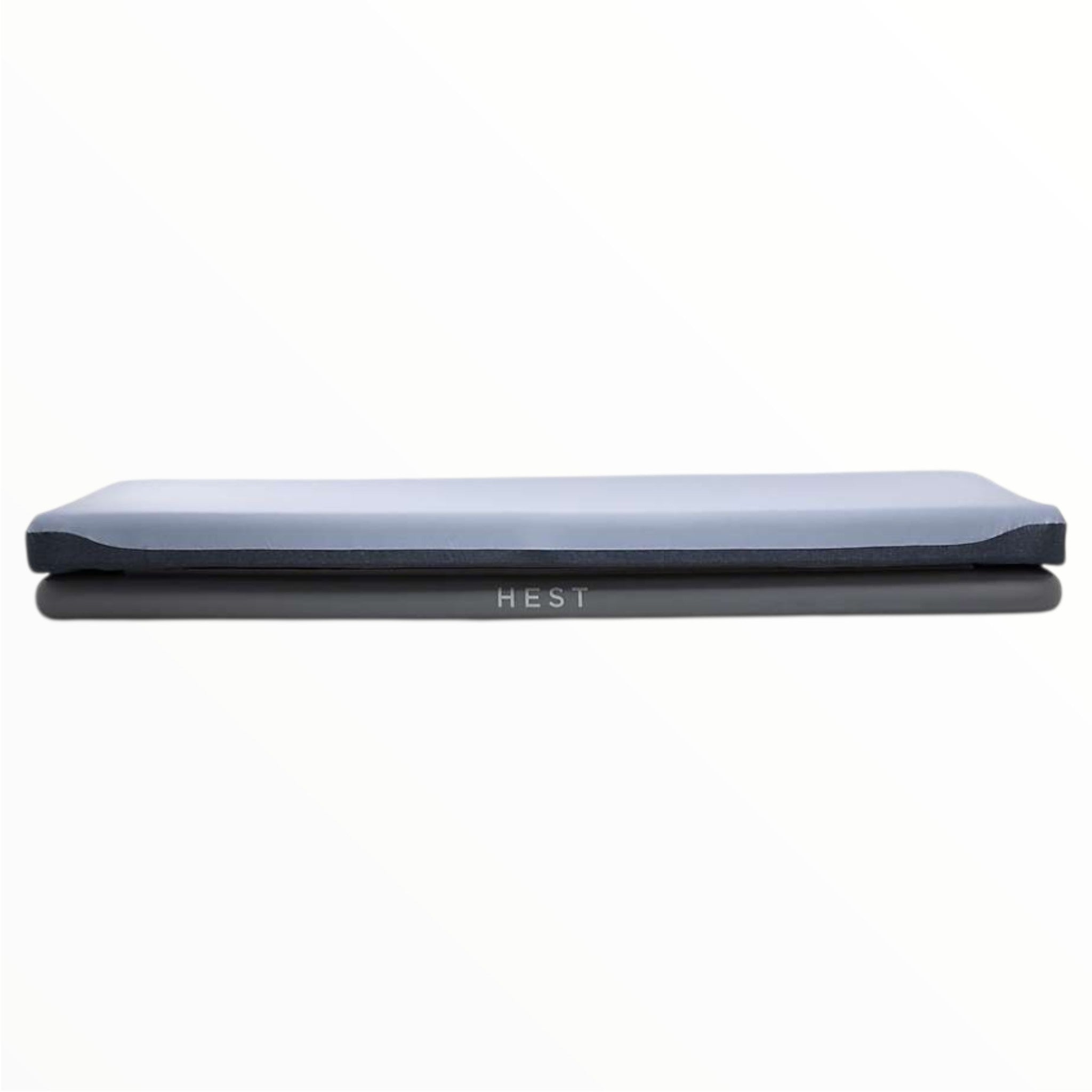 HEST sleep system sleeping pad, folded blue-gray with HEST logo