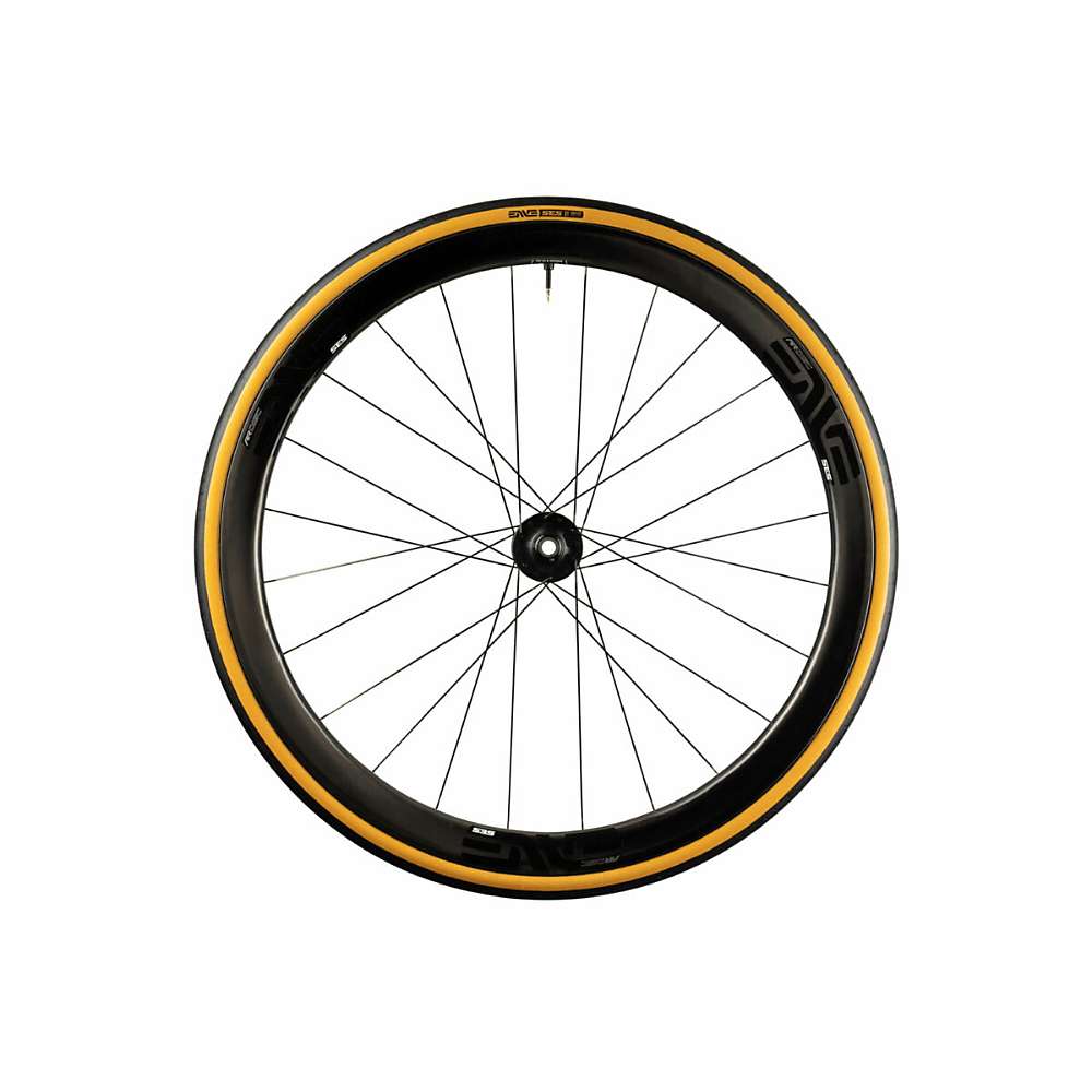 A black bicycle wheel with a deep carbon rim and yellow ENVE SES Tubeless Ready Tire, featuring the ENVE logo and evenly spaced spokes, offers excellent road grip and is shown against a white background.
