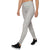 A person shown from the shoulders down walks forward in GoLite Womens ReBound Leggings, featuring a light gray and white pattern, paired with black athletic shoes against a white background.