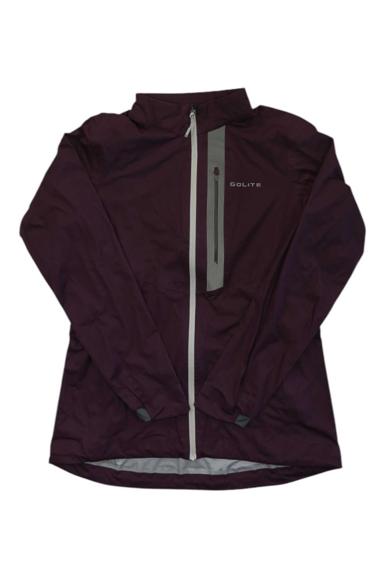The GoLite Womens Ready Set Go Shell Jacket is a dark purple, lightweight shell with long sleeves, a high collar, full front zipper, vertical gray accent, and the GoLite logo on the left chest.