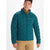 A man wears a teal Marmot Mens WarmCube Active Novus Jacket and tan pants, standing forward with a slight smile, looking off to the side against a plain white background.