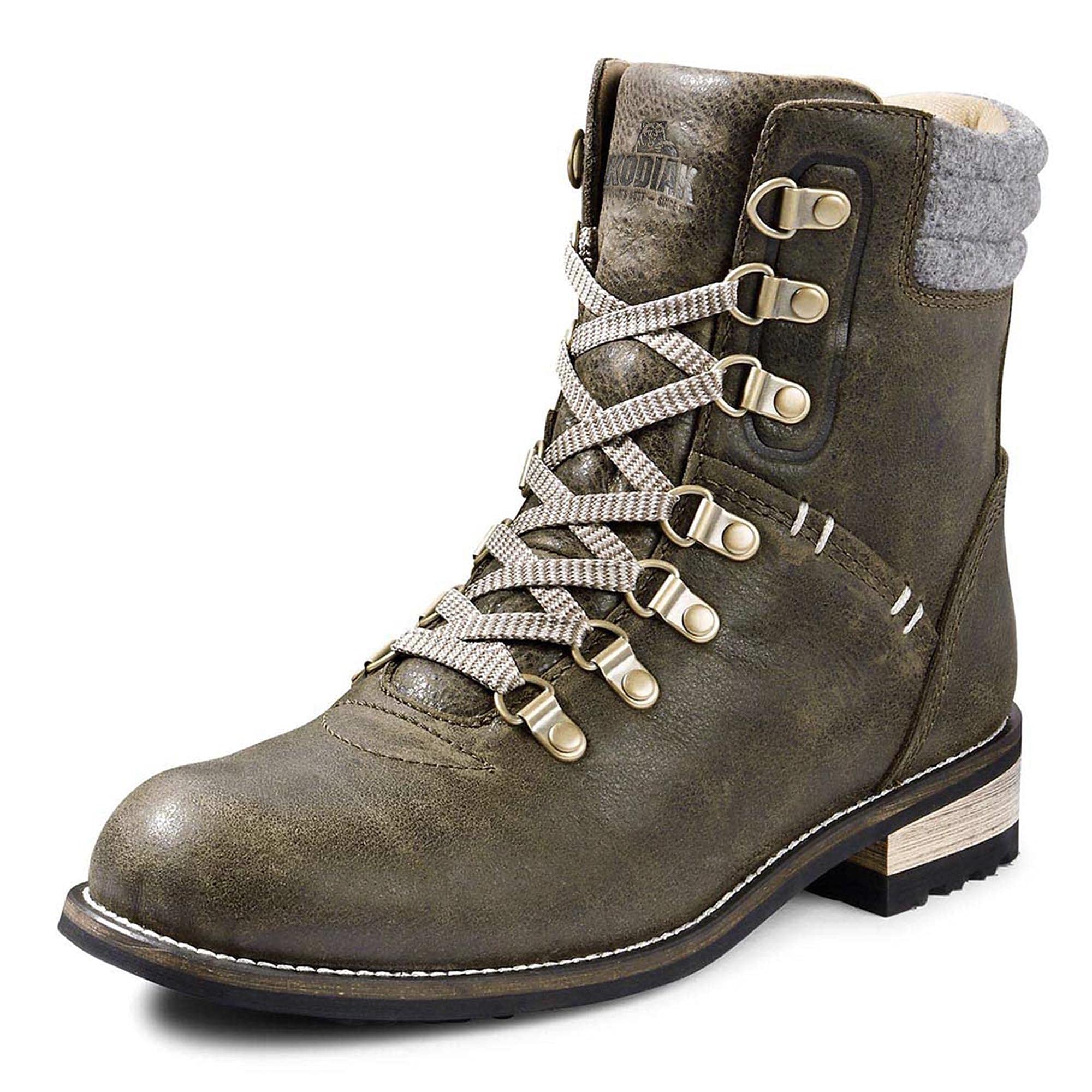 The Kodiak Women's Surrey II Waterproof Leather Boots feature rugged brown leather, metal eyelets, beige patterned laces, a grey padded collar, and a low wooden heel for stylish durability, shown on a white background.