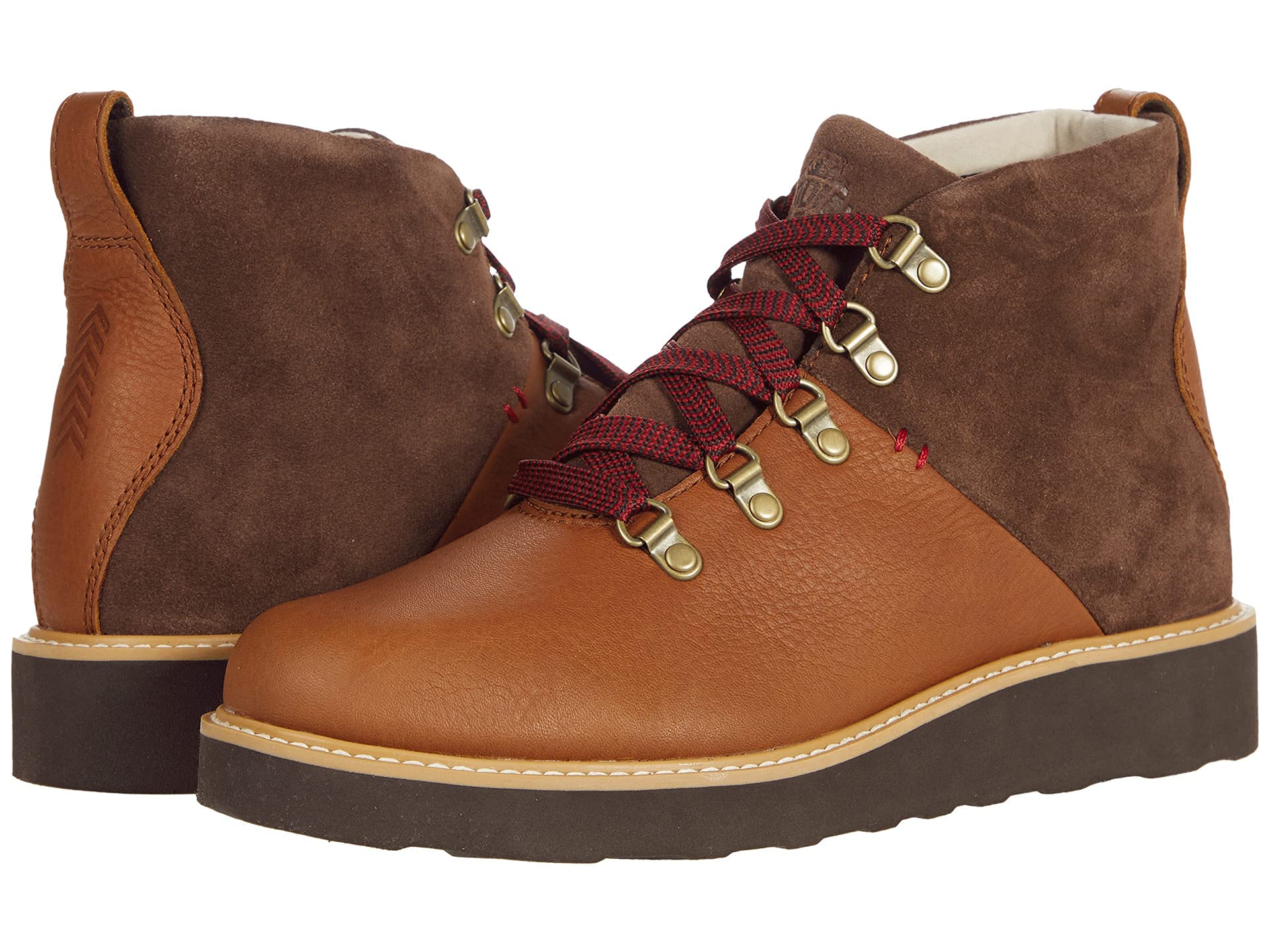 The Kodiak Sauveur Alpine Wedge Boot features a durable design with light brown leather, dark brown suede uppers, red and black laces, metal eyelets, and thick dark brown rubber soles for reliable outdoor performance.
