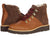 The Kodiak Sauveur Alpine Wedge Boot features a durable design with light brown leather, dark brown suede uppers, red and black laces, metal eyelets, and thick dark brown rubber soles for reliable outdoor performance.