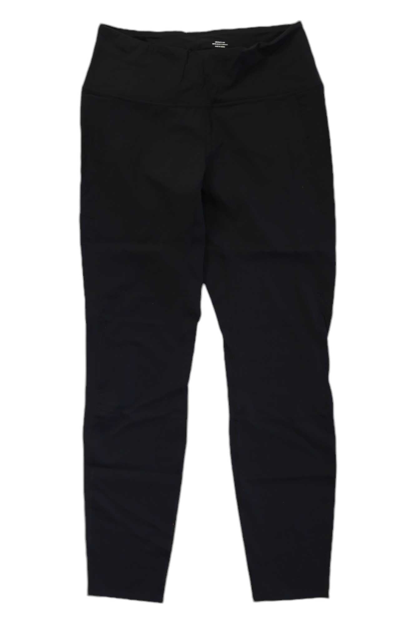 The Norrona Womens Tight leggings are laid flat on a white background, showcasing a high-rise waistband and slim, tapered legs for premium stretch and comfort.