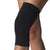 A close-up of a person’s knee wearing the CW-X Women's Stabilyx Knee Support, a black, moisture-wicking compression sleeve that provides support and coverage around the knee joint.