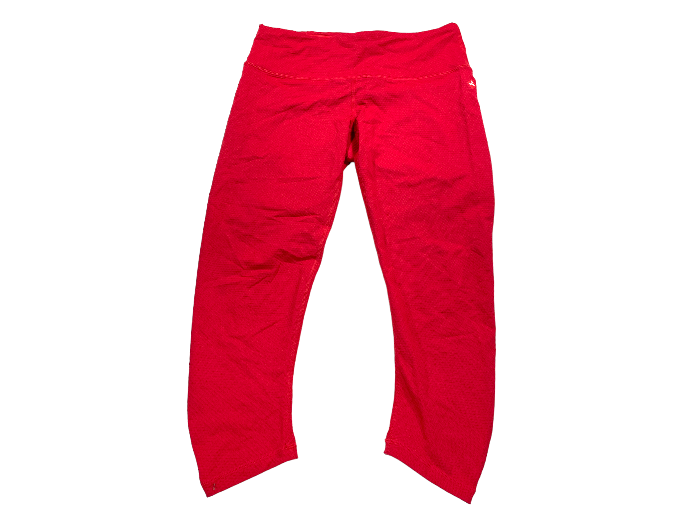 The Prana Women’s Misty Knickers in bright red feature a high waistband and smooth, stretchy, moisture-wicking fabric—perfect for hiking, exercise, or casual wear. Laid flat on a white background.