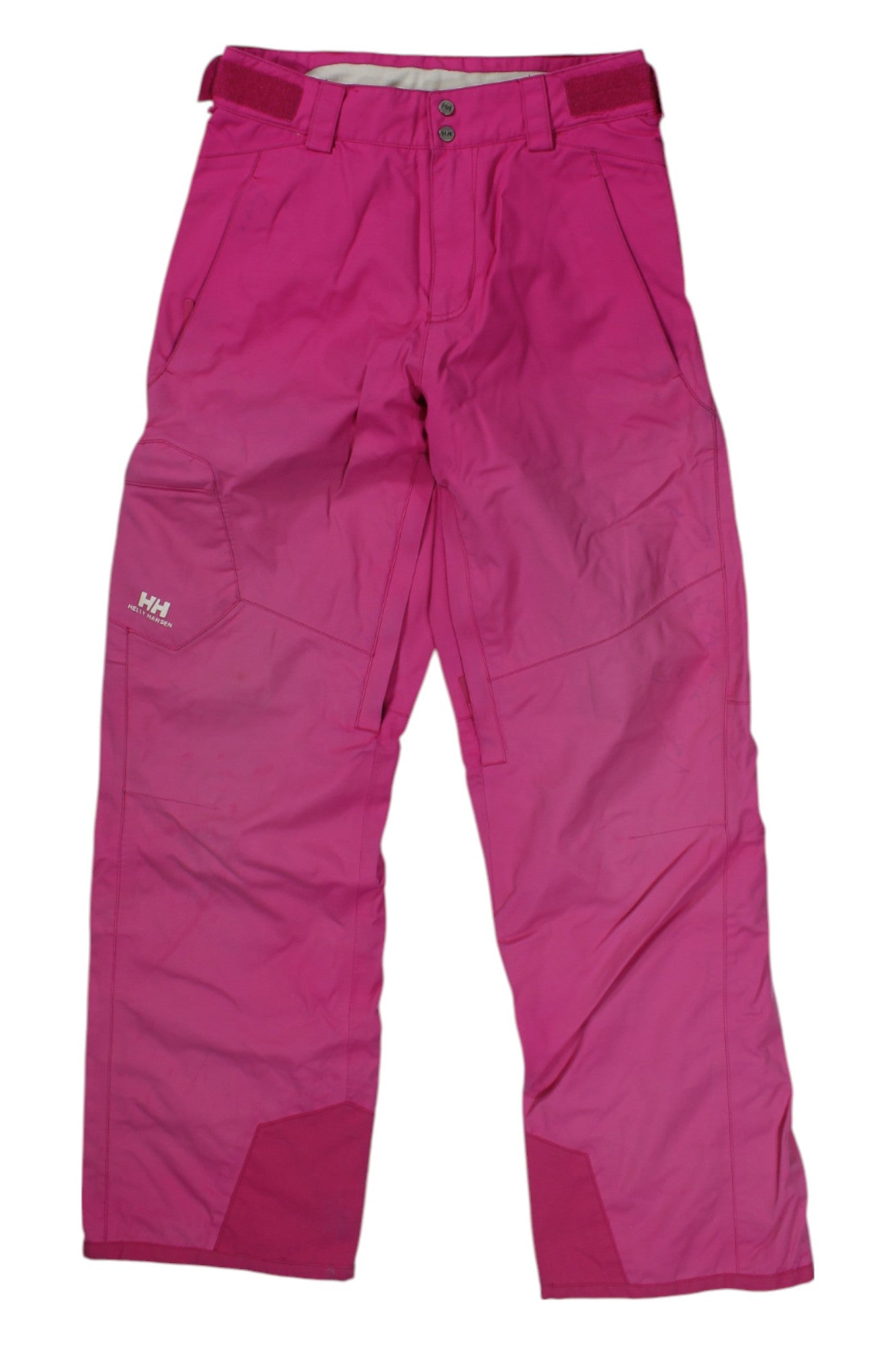 Helly Hansen Tech Women's Snow Pants in bright pink feature reinforced lower legs, multiple pockets, belt loops, and adjustable Velcro waistband, shown flat on a white background.