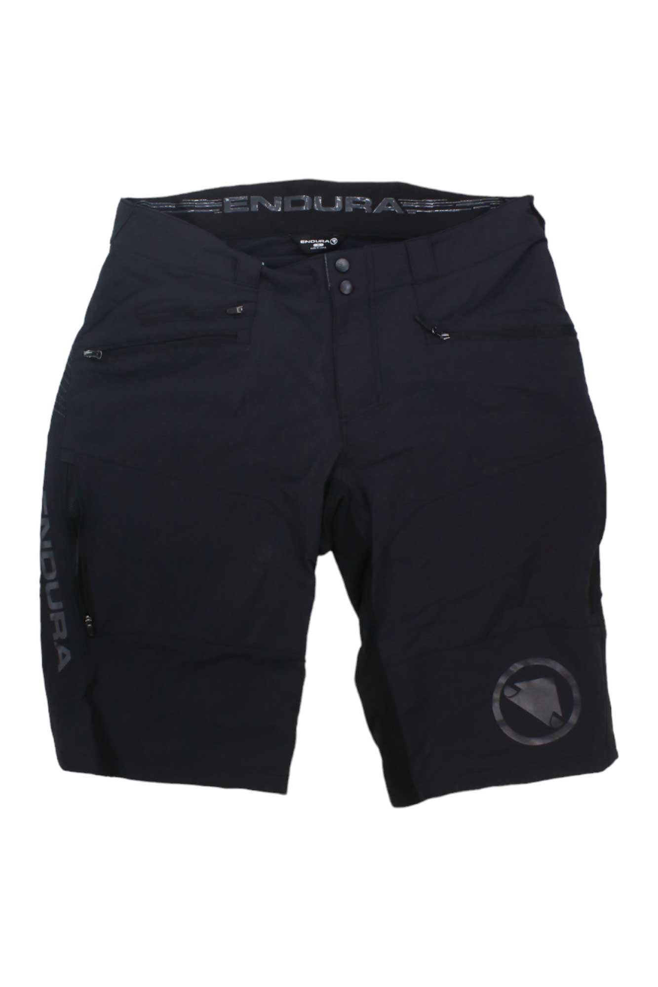 The Endura Mens SingleTrack II Short in black features zippered side pockets, ENDURA logos on the waistband and left leg, plus a circular logo on the right thigh—ideal for mountain biking. Shown flat against a white background.