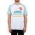 A person wearing the Moosejaw Men's Iceberg Salad Raglan SS Tee, a white and light blue casual crew shirt with a mountain graphic, red sun, green wavy lines, and "MOOSEJAW" printed on the front.