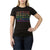 Wearing the Moosejaw Women's Confetti Cake SS Tee—an organic cotton black shirt with colorful MOOSEJAW letters and unique O symbols—a woman stands confidently, one hand on her hip.