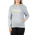 A woman wearing a gray Moosejaw Womens Original Frame Pullover Hoody, made from organic cotton and recycled polyester fleece, with white drawstrings and a front pocket, stands in black pants with one hand in her pocket.