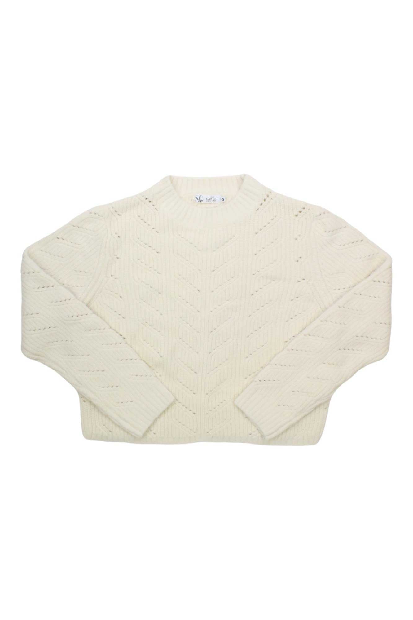 The Carve Designs Womens Monroe Sweater is a cream long-sleeve, chunky cable-knit sweater with a crew neckline, shown laid flat on a white background.