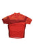 The Endura Kids Hummvee Ray SS Jersey is a short-sleeve red and orange cycling jersey featuring patterned shoulders, a quarter-zip collar, triple rear pockets, and ENDURA branding across the chest.
