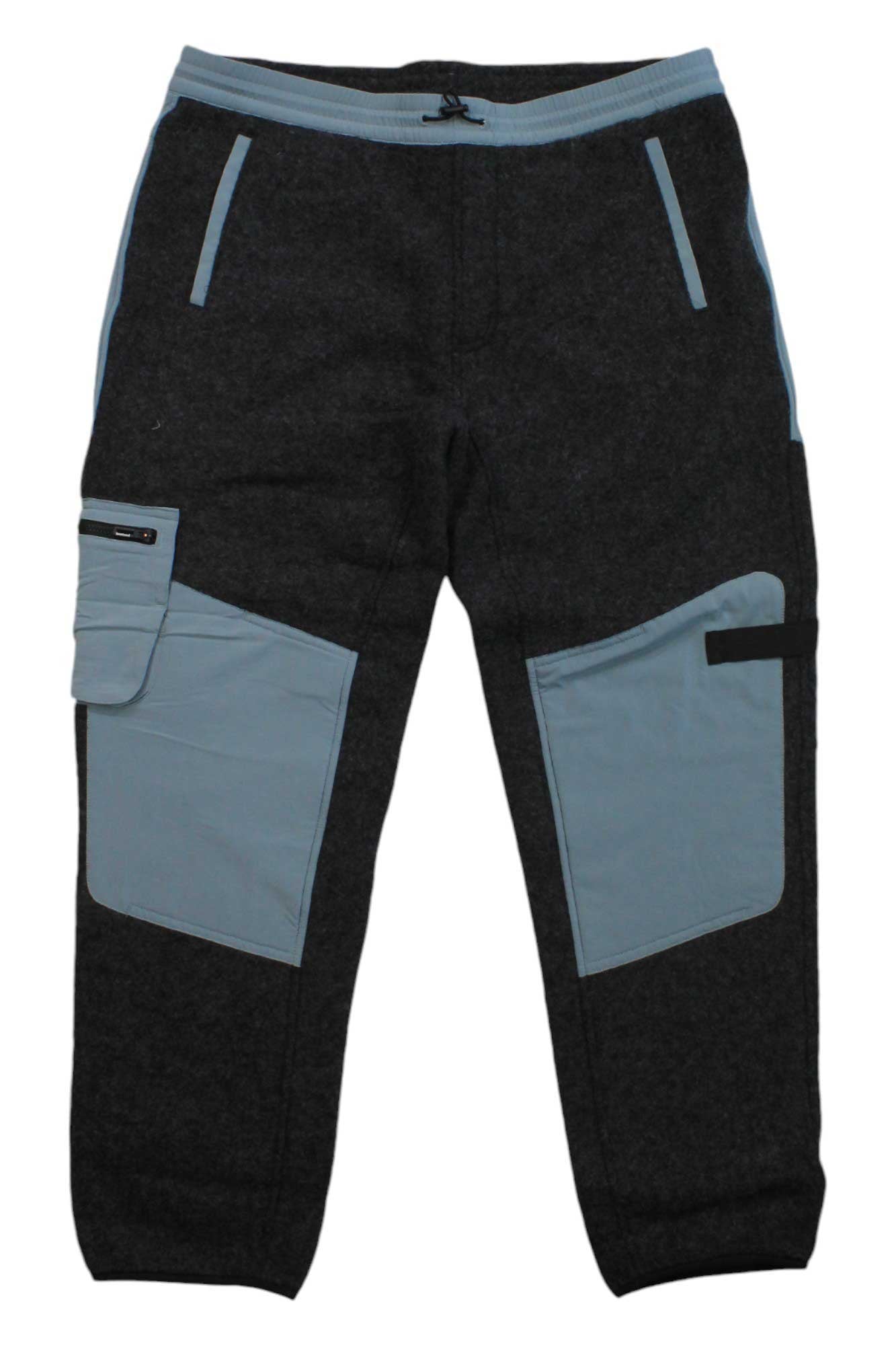 The Smartwool Mens Hudson Trail Fleece Pant features a dark gray design with light gray waistband, hem, and pocket details, inspired by men's trail pants. It has two large light gray front pockets—one with a flap and zipper—and black zipper accents.