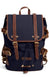 Navy canvas tier backpack with tan leather trim, flap front, and adjustable shoulder straps