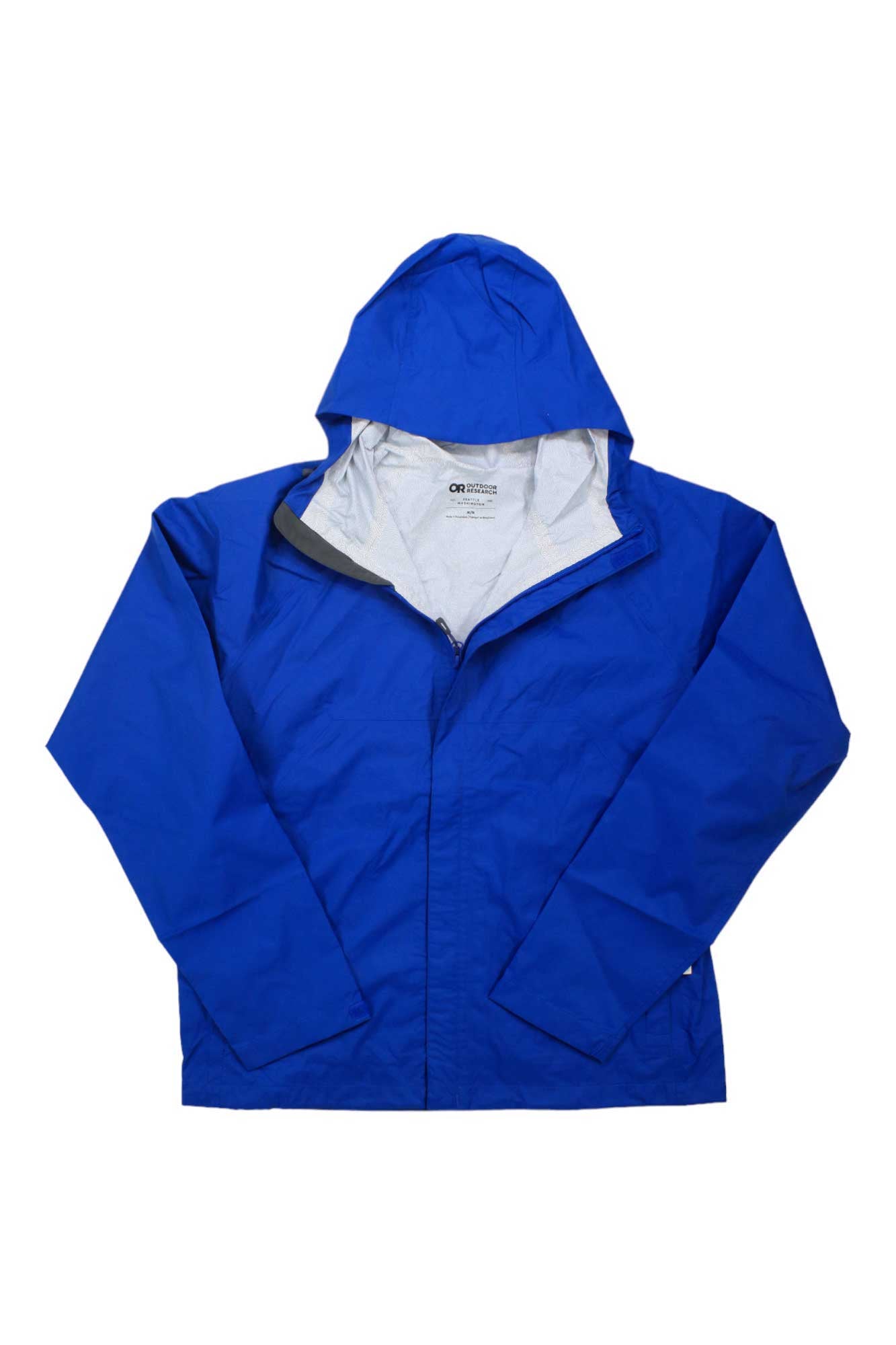 The Outdoor Research Mens Apollo Jacket is a bright blue waterproof jacket with long sleeves, front zipper, and light grey interior lining, shown flat on a white background—ideal mountain biking gear for unpredictable weather.