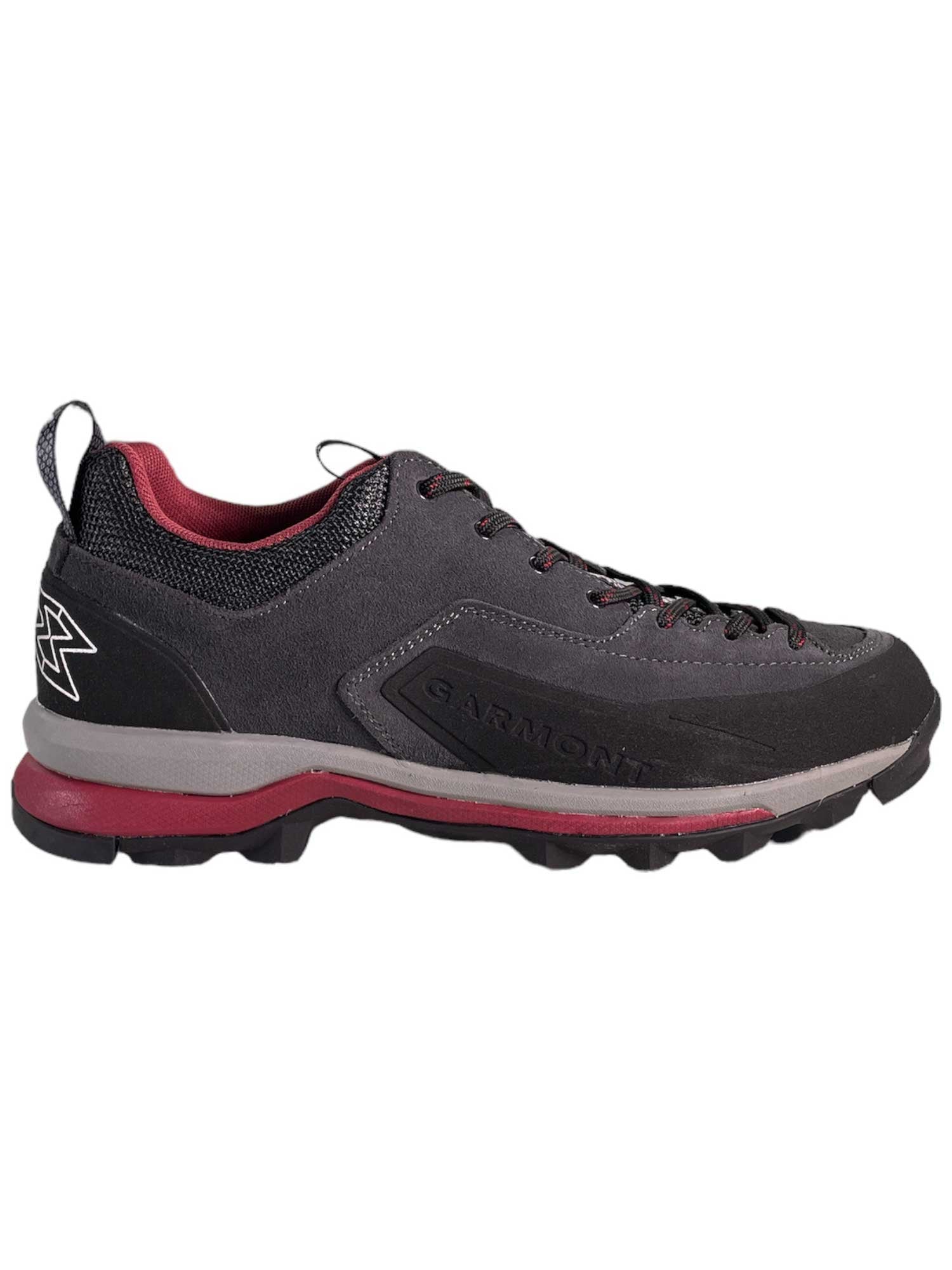 A single Garmont Womens Dragontail Shoe in dark grey and black with red accents is shown in side profile, featuring a textured sole and visible Garmont logo, set against a white background.
