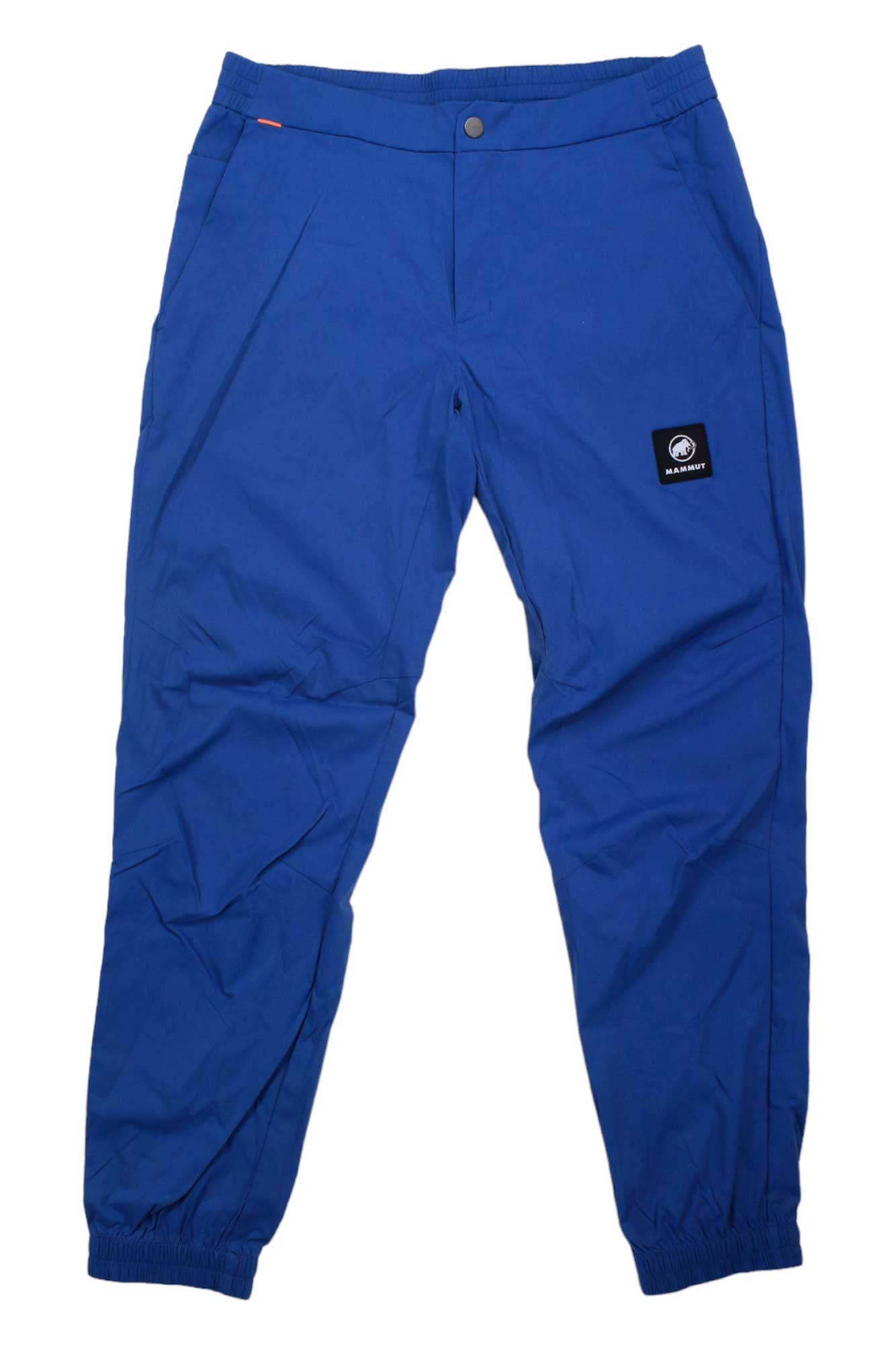 The Mammut Mens Massone Light Pant is an eco-friendly bright blue jogger with an elastic waistband, front pockets, elastic cuffs, and a black logo patch—ideal stylish hiking pants for outdoor adventures.