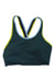The Cotopaxi Womens Mari Crop Bra is a dark teal recycled polyester sports bra with light blue and yellow trim, racerback straps, and quick-dry fabric, shown laid flat on a white background.