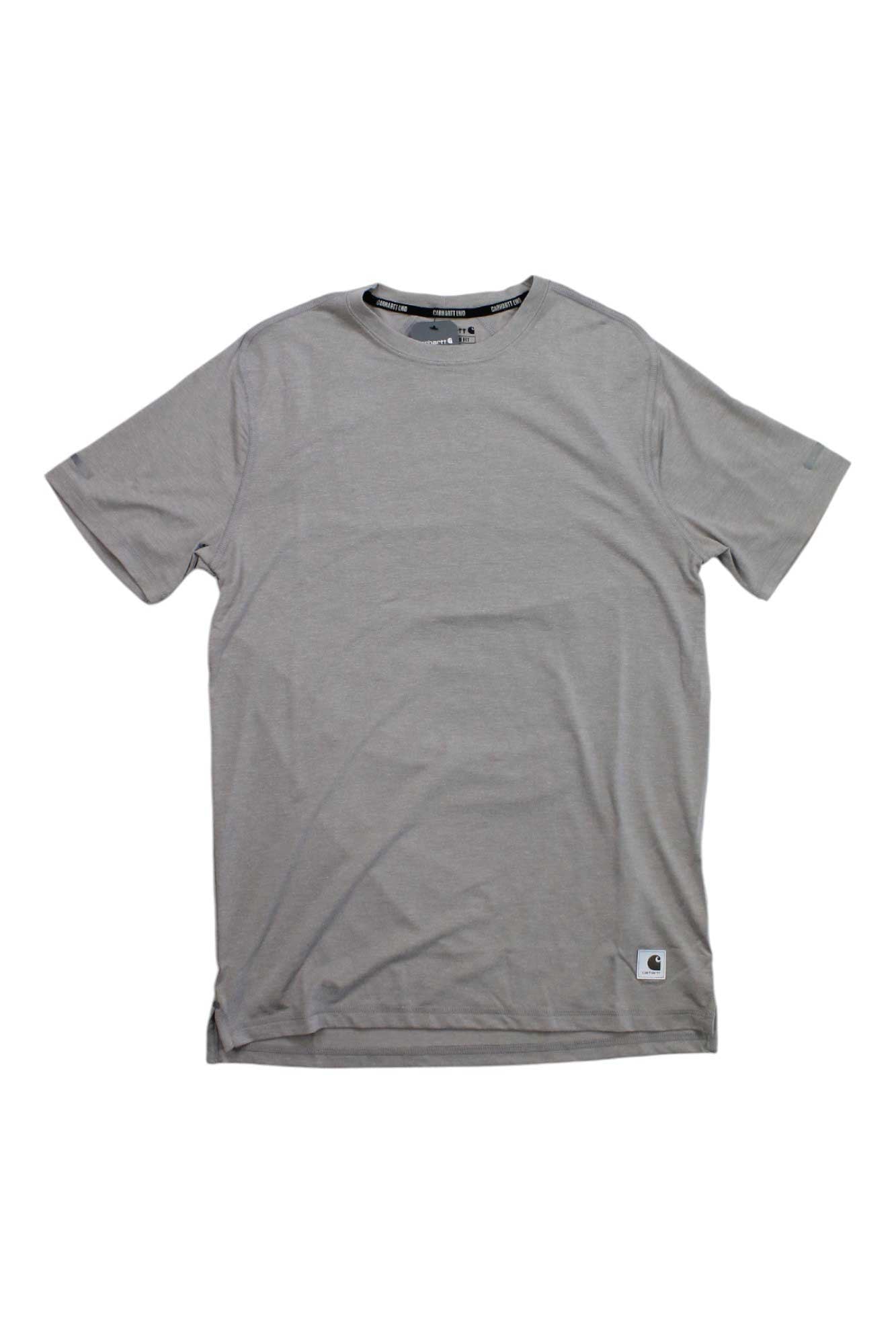 The Carhartt Mens LWD Relaxed Fit Short Sleeve T-Shirt in plain light gray is shown laid flat on a white background, featuring a small rectangular logo tag near the bottom hem for a stylish, comfortable everyday look.
