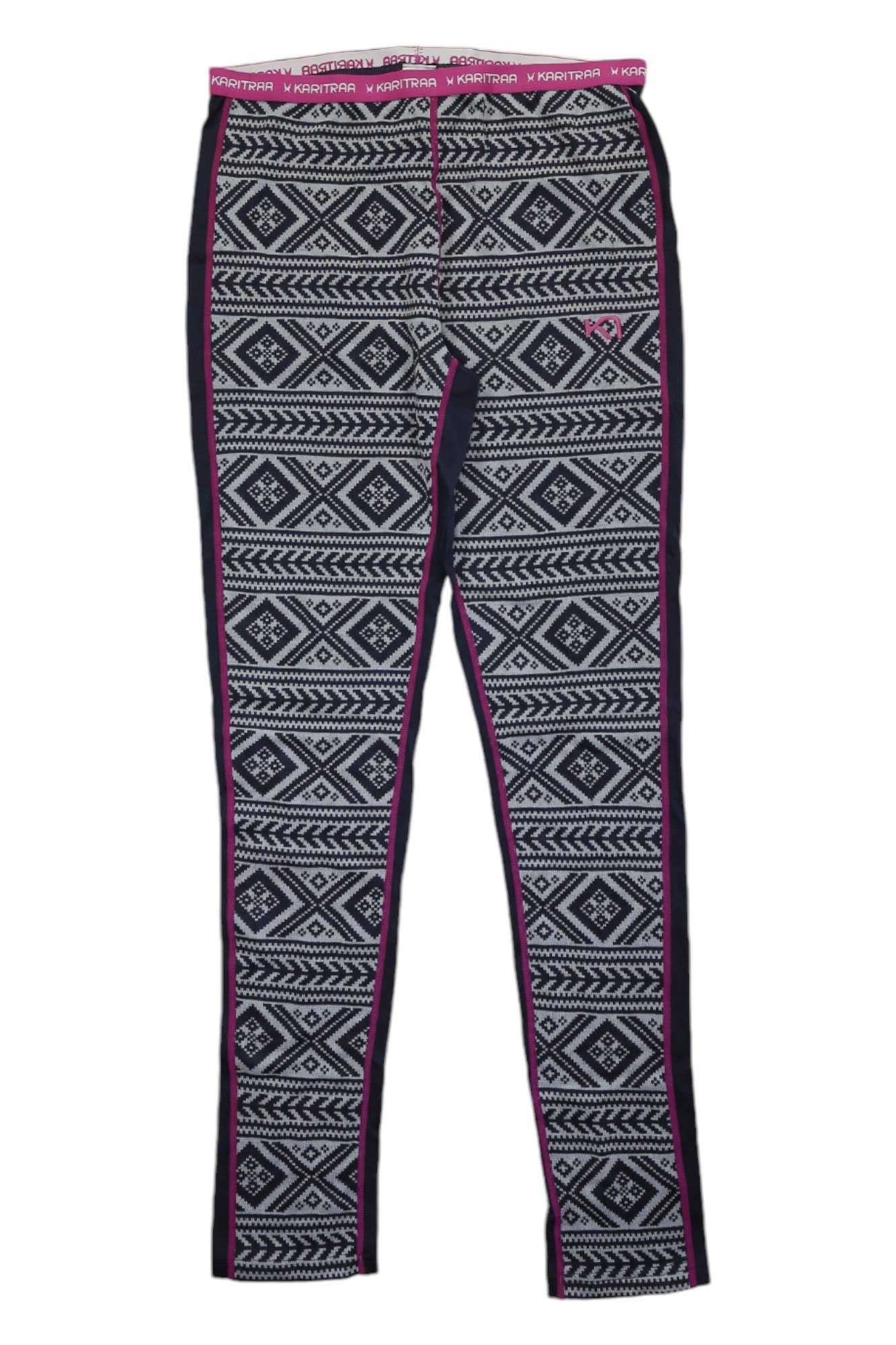 The Kari Traa Womens Floke Pant features black and white geometric and diamond patterns, is made from a cozy wool-modal blend, and is detailed with pink piping on the seams and a pink logo waistband.