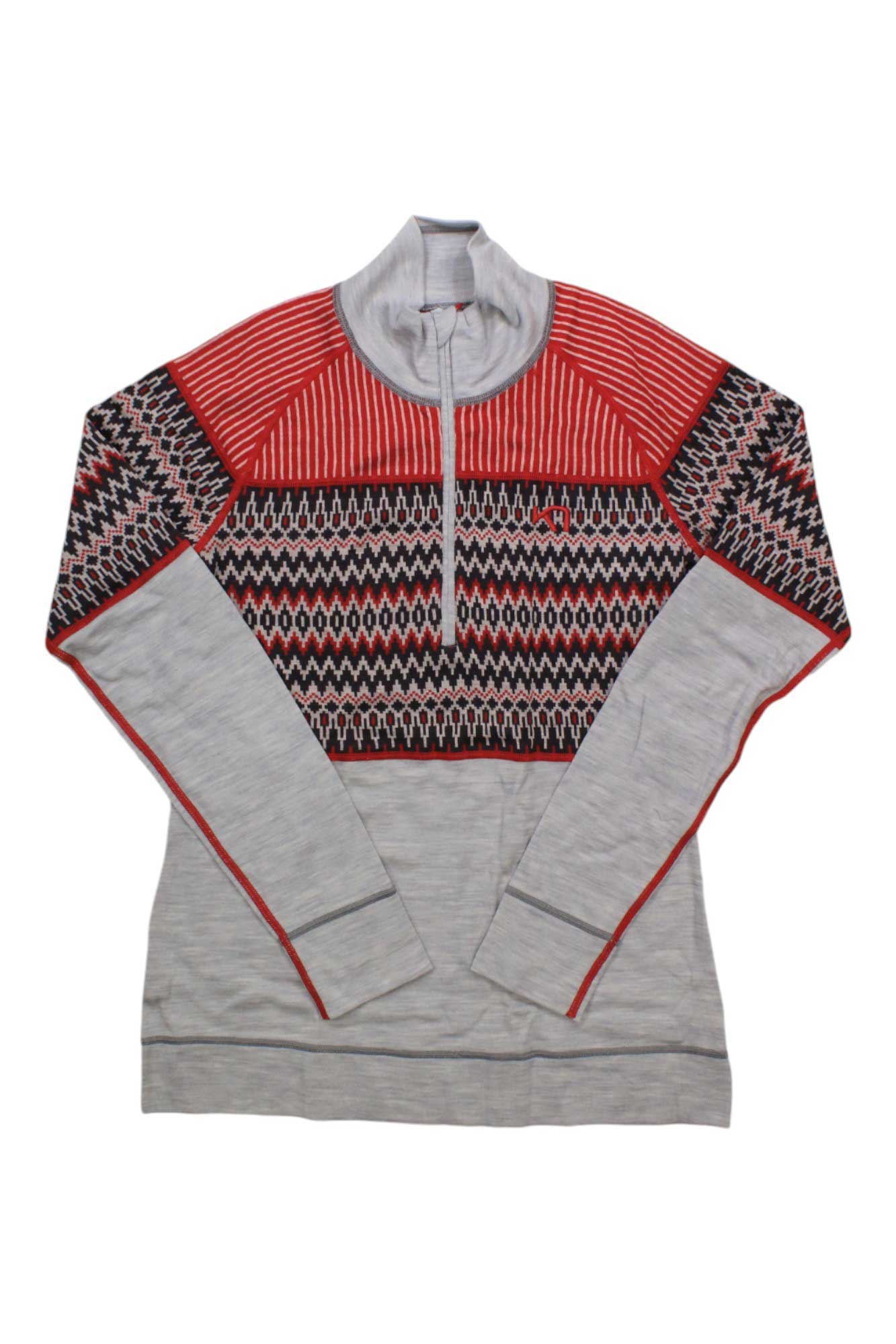 The Kari Traa Women's Silja Half Zip Top is a light gray merino wool base layer with a high collar, half-zip, red, black, and white geometric patterns on the upper chest, shoulders, and sleeves, plus bold red trim accents.