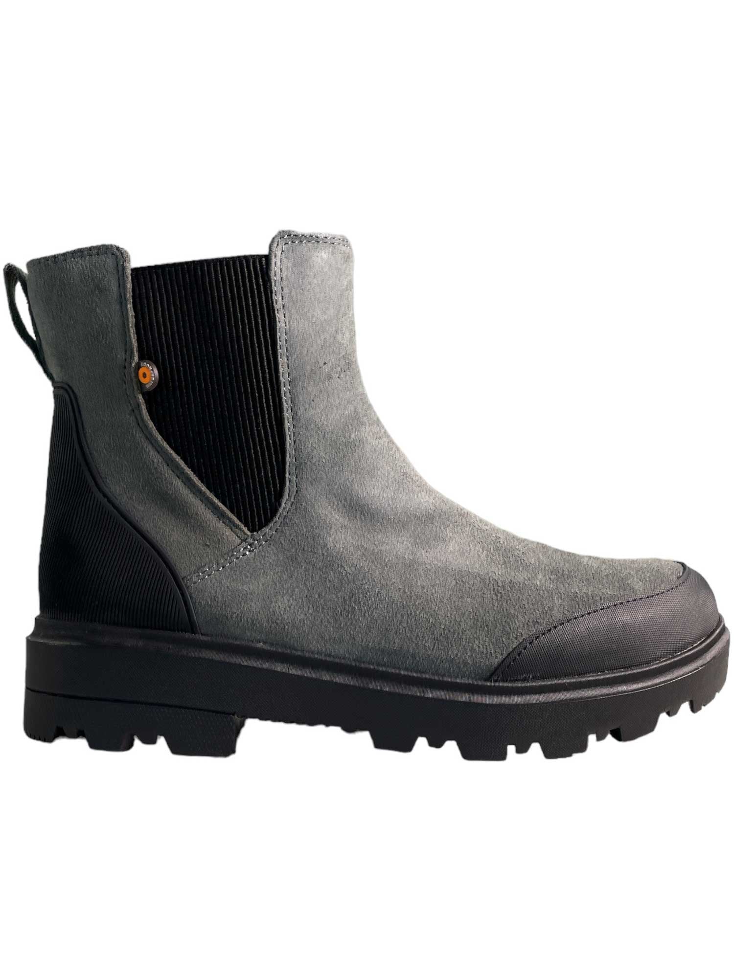 Bogs Womens Holly Chelsea Leather Boot in gray suede features black elastic side panels, a black heel pull tab, and a rugged black rubber sole. This eco-friendly women's footwear is shown in a side view on a white background.