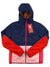 The Cotopaxi Womens Teca Calido Hooded Printed Jacket is a color-blocked women’s jacket with recycled insulation, navy blue top, red sleeves, pink lower panels, front zipper, and a red tag with a white rabbit logo on the zipper pull.