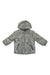 The Obermeyer Kids Ash Jacket is a gray, hooded, water-resistant children's jacket with a leaf-like pattern, front zipper, and two zippered pockets—ideal for outdoor adventures.