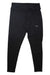 The Kari Traa Women's Nora 2.0 Tight is a pair of black, high-waisted hiking tights for women with a small white logo on the left thigh and 4-way stretch material, shown laid flat on a white background.