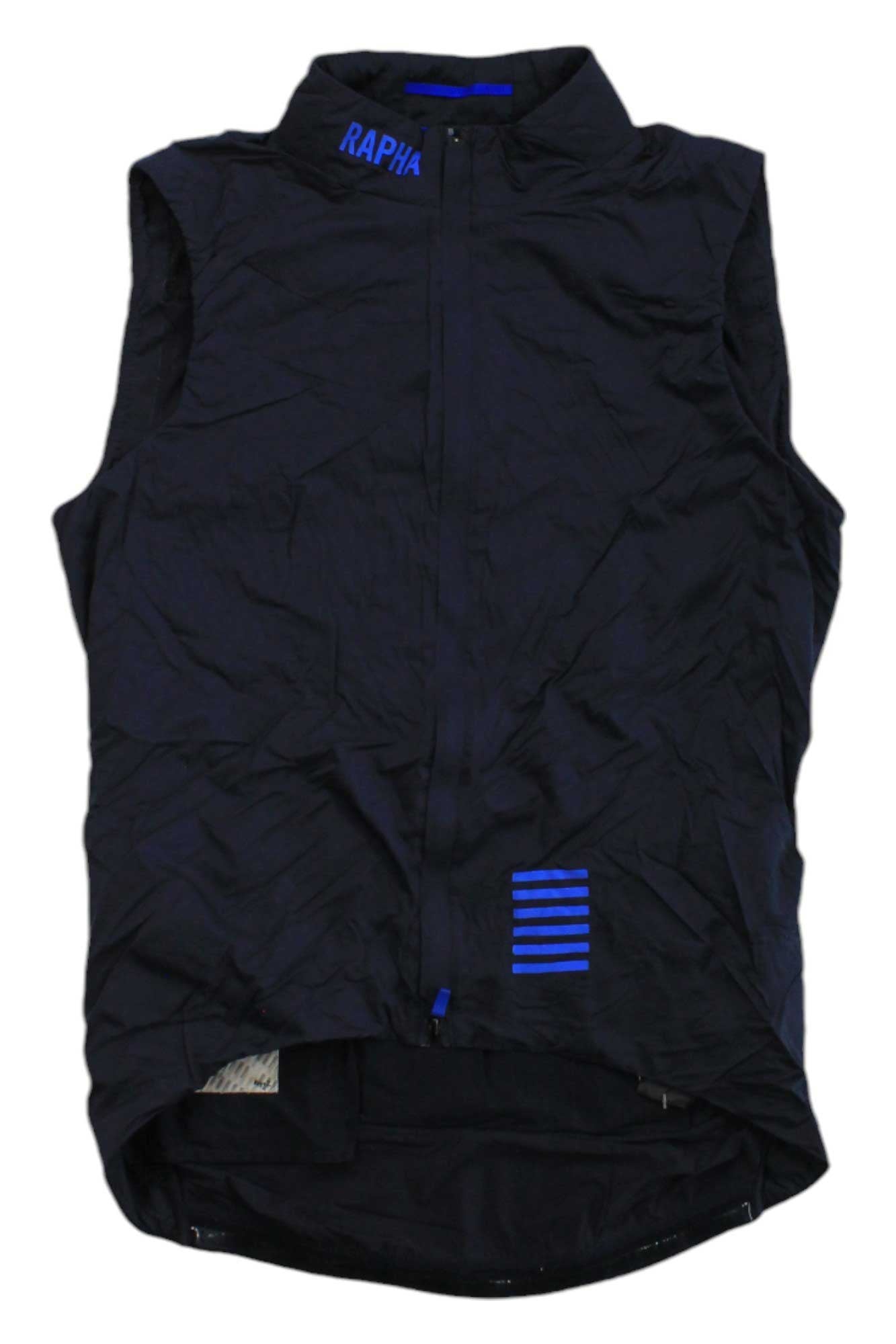 The Rapha Men's Pro Team Insulated Gilet is a sleeveless black cycling vest with a front zipper, blue RAPHA text on the high collar, blue horizontal stripes near the bottom, and an extended back hem for extra coverage.
