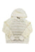 The Holden Womens Hybrid Down Hoodie is a cream-colored jacket with a quilted, padded front, long sleeves, front pocket, plain hood, water repellent finish, and a visible brand tag at the neck.