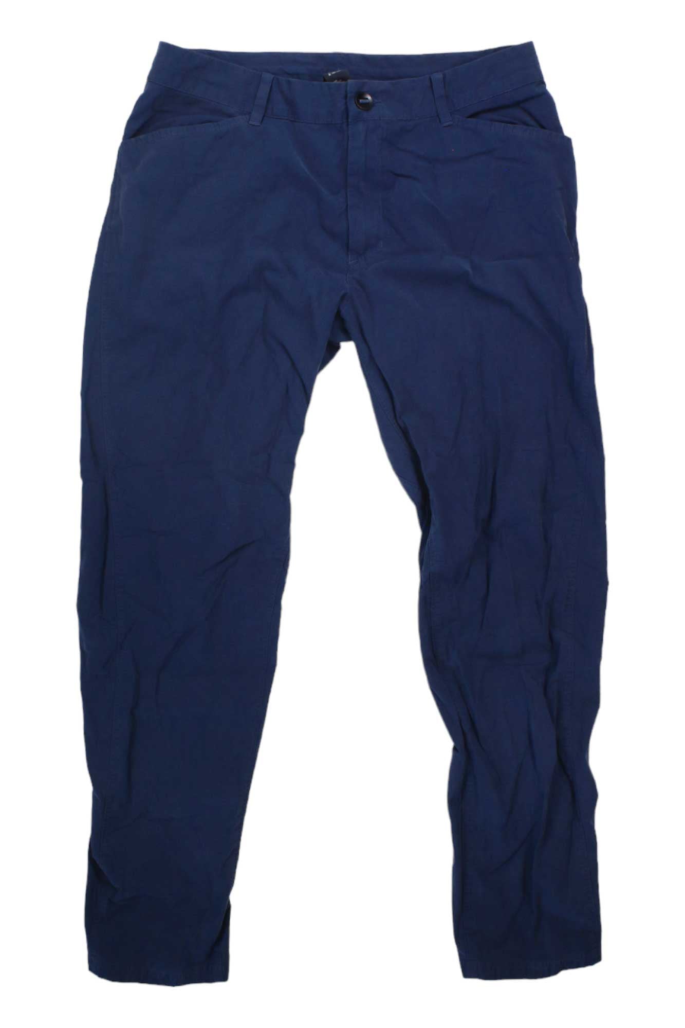 The Men's Sustenpass Climb Pants, made from a durable cotton-nylon blend in dark blue and ideal for hiking, are shown laid flat on a white background.