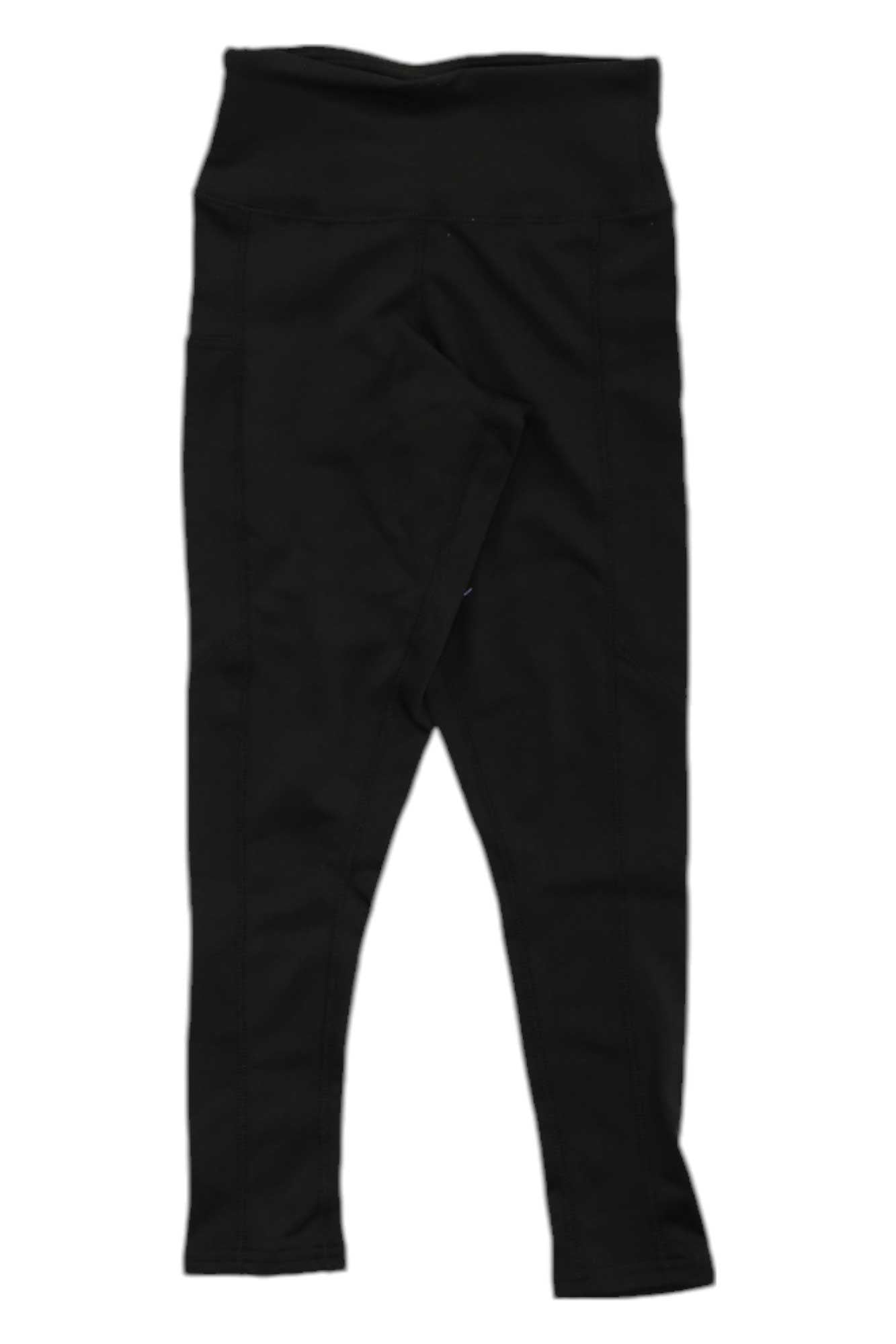 Polarmax Women's Stretch3 Super Mid-Weight Pocket Capri laid flat on a white background with one leg crossed over the other. Made from moisture-wicking fabric for all-day comfort.