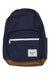 The Herschel Supply Company Pop Quiz Backpack is navy blue with a brown faux leather base, features a front pocket with white zipper, and has a rectangular white Herschel label—ideal for urban use.
