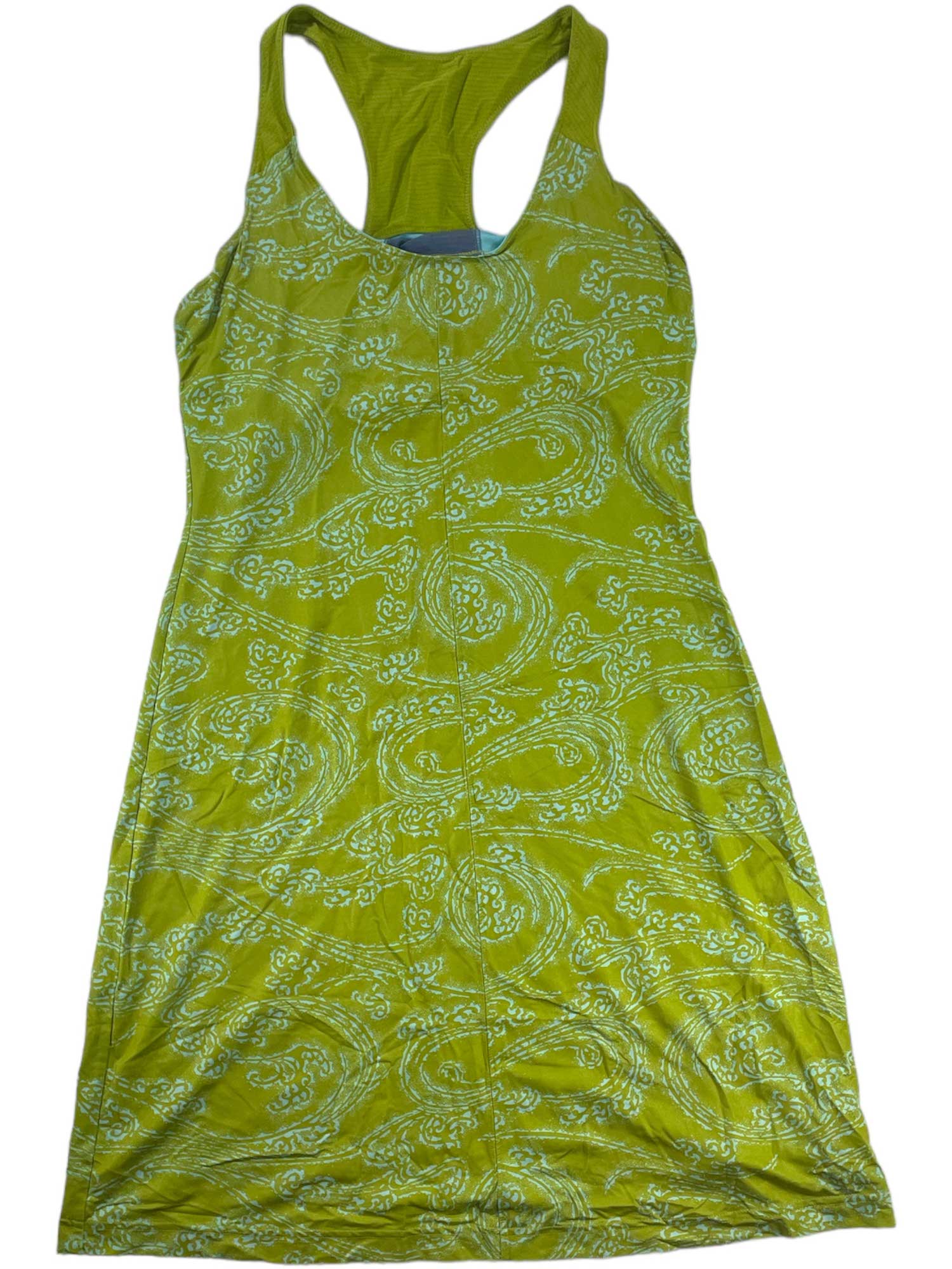 The Omni Shade Sports Dress is a sleeveless, racerback, knee-length dress in bright green with a white paisley print. Made from lightweight fabric with cooling technology, it’s perfect for casual wear on warm days.