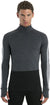 A man with short brown hair wears the Icebreaker Men's Merino 200 Zoneknit LS Half Zip Top in dark gray and black, featuring thumb holes. He stands against a plain white background facing forward with a neutral expression.