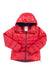 The Kari Traa Womens Tirill Down Jacket is a bright red, hooded, insulated down puffer with a front zipper, folded sleeves, inner collar brand tag, padded and water-repellent—built for cold weather and outdoor use.