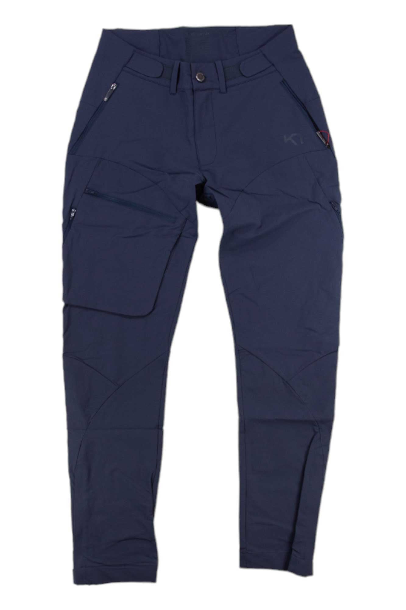 Kari Traa Womens Voss Pant in navy blue, featuring zippered pockets, a large cargo pocket on the left leg, belt loops, water-repellent fabric, and reinforced knees, displayed flat on a white background.