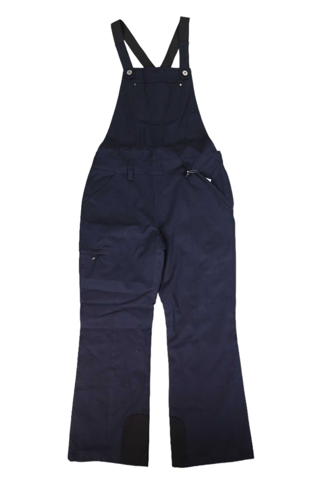 The Obermeyer Womens Malta Overalls Bib in navy blue features adjustable shoulder straps, a front chest pocket, side zipper pockets, and wide legs. These waterproof ski overalls are shown laid flat on a white background.