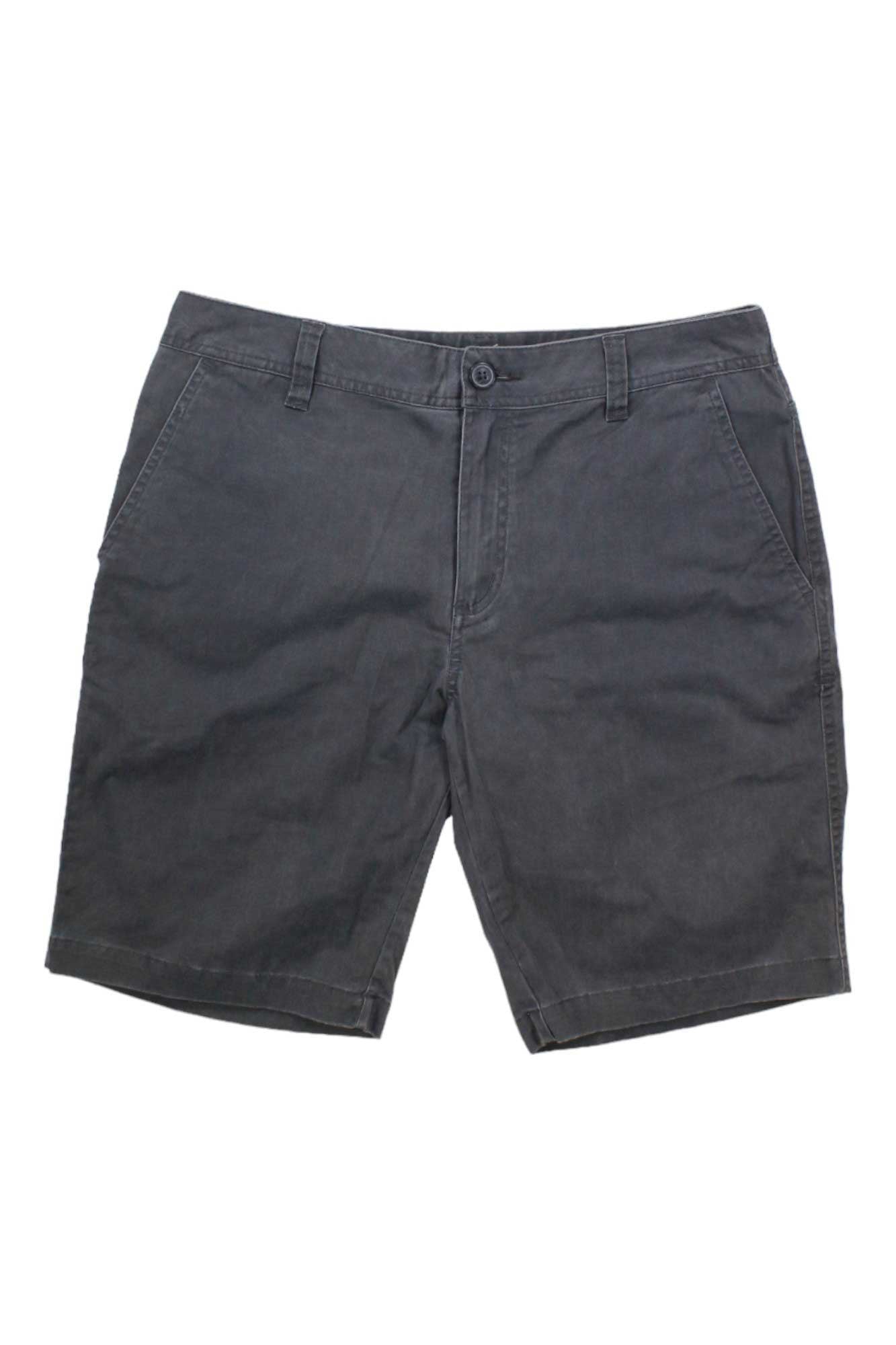 A pair of Toad & Co Men's Mission Ridge 10.5 Inch Shorts in dark gray organic cotton, featuring front pockets, belt loops, and a button closure, displayed flat on a white background.