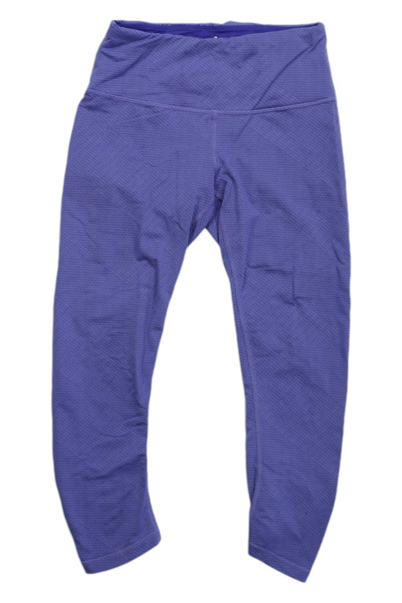 A pair of Prana Womens Misty Knickers in purple, featuring a textured, high-waisted design with a wide waistband and moisture-wicking activewear fabric, displayed flat on a white background.