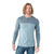 A man with wavy, shoulder-length blond hair wears the Smartwool Mens Merino Sport 150 Henley, featuring moisture-wicking fabric and a textured blue yoke and sleeves, paired with blue jeans, standing against a white background.