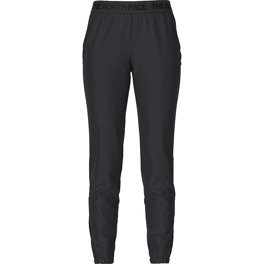 The North Face Womens Wander Jogger—black slim-fit joggers for women with side pockets, an elastic waistband, and THE NORTH FACE branding. Made from moisture-wicking FlashDry-XD fabric. Shown against a white background.