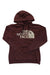 The North Face Women's Half Dome Pullover Hoodie in maroon, with a front pocket and white logo text on the chest, shown on a white background.