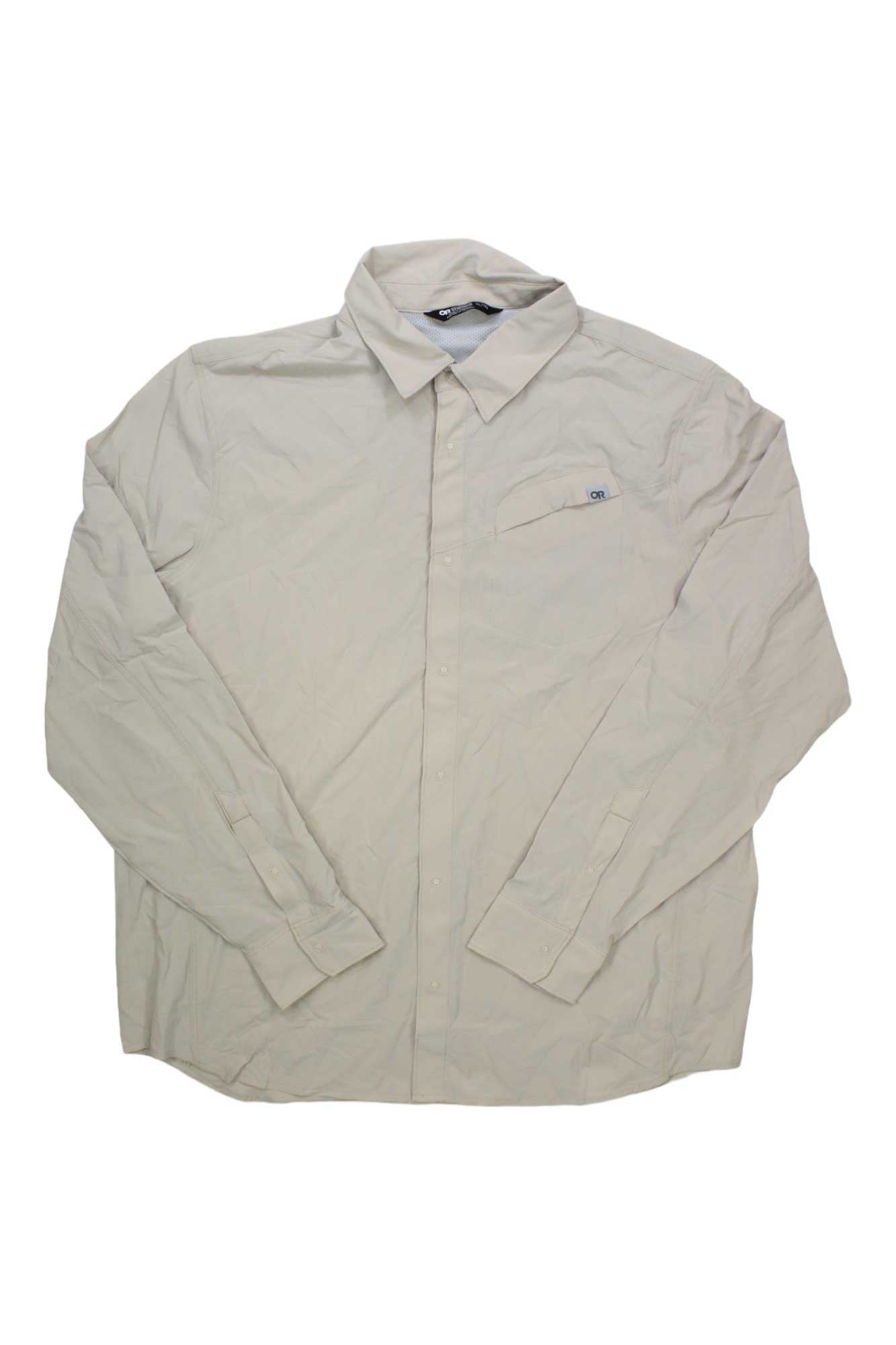The Outdoor Research Men's Astroman LS Sun Shirt is a long-sleeve, light beige, UPF 50+ button-up with a collared neckline and single chest pocket, shown laid flat on a white background.
