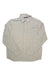 The Outdoor Research Men's Astroman LS Sun Shirt is a long-sleeve, light beige, UPF 50+ button-up with a collared neckline and single chest pocket, shown laid flat on a white background.